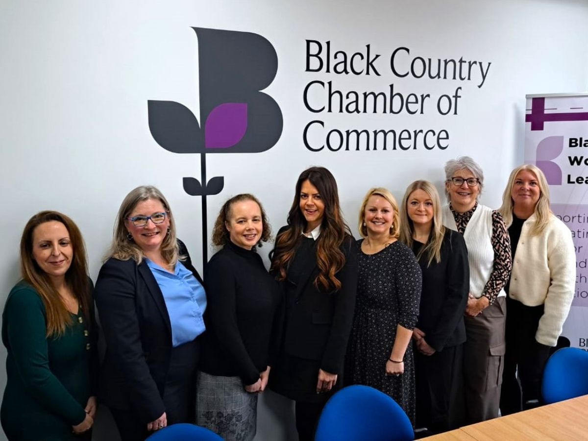Eight of the Women in Leadership in front of a white wall with the Black Country Chamber of Commerce logo. From left to right we have: Vikki Potts, Claire Lawton, Silvia Parnaby, Lucy Rook, Helen Sargeant, Amy Brokenshire, Debra Lawrence, Lynn Wyke 